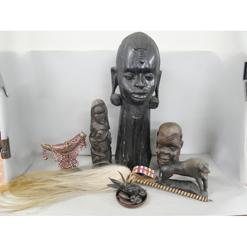 2302 - Five African tribal carvings including a large and heavy mid-century ebony figure and a fly swat