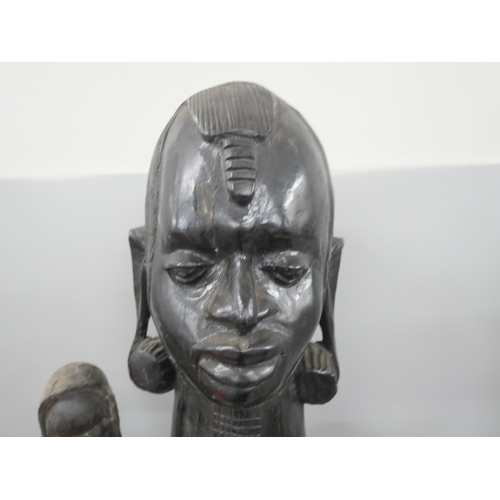 2302 - Five African tribal carvings including a large and heavy mid-century ebony figure and a fly swat