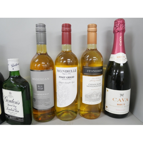 2304 - A collection of wines and spirits including Martell Cognac, Gordon's Gin, Champagne, etc. (9)