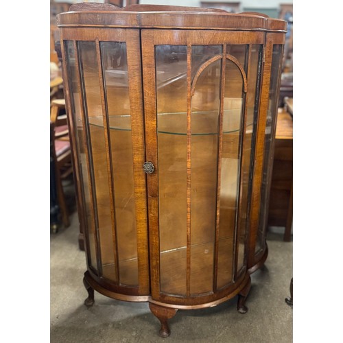 217 - An early 20th Century walnut display cabinet