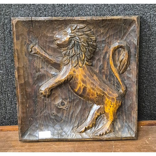 362 - A carved pine relief depicting a lion