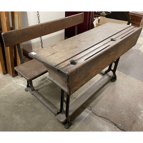 309 - A Victorian cast iron and oak school desk