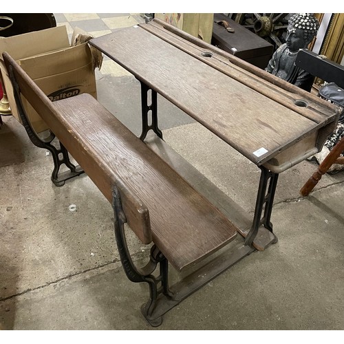 309 - A Victorian cast iron and oak school desk