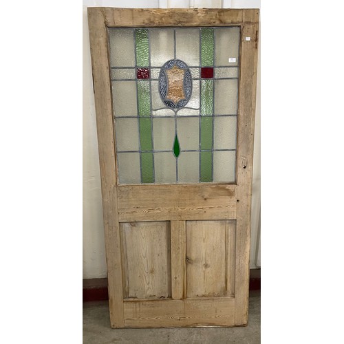 313 - A Victorian pine and stained glass door