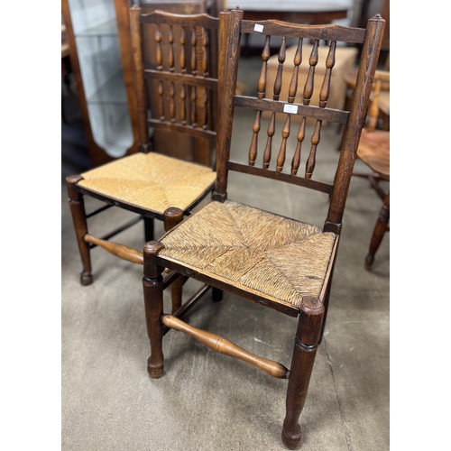 239 - A pair of George III elm and rush seated Lancashire ladderback chairs