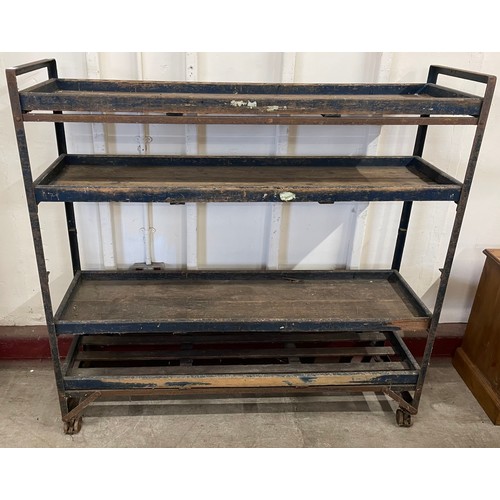 315 - A steel and pine four tier bakers rack