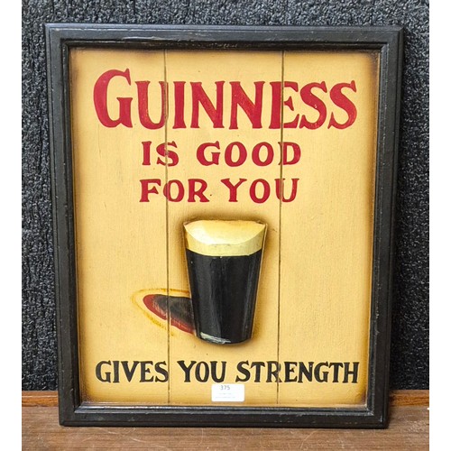 375 - A painted wooden Guinness advertising sign