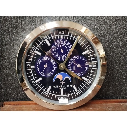 379 - A Patek Philippe style dealers display wall clock