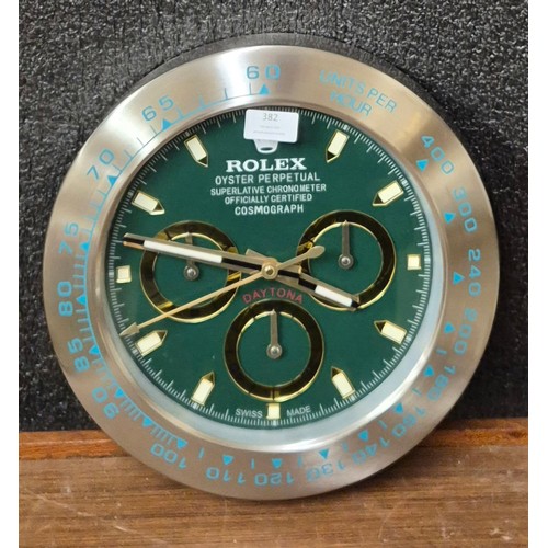 382 - A Rolex style dealers display wall clock