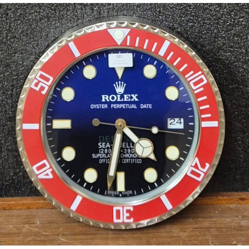 381 - A Rolex style dealers display wall clock