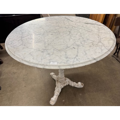 319 - A cast iron and circular marble topped garden table