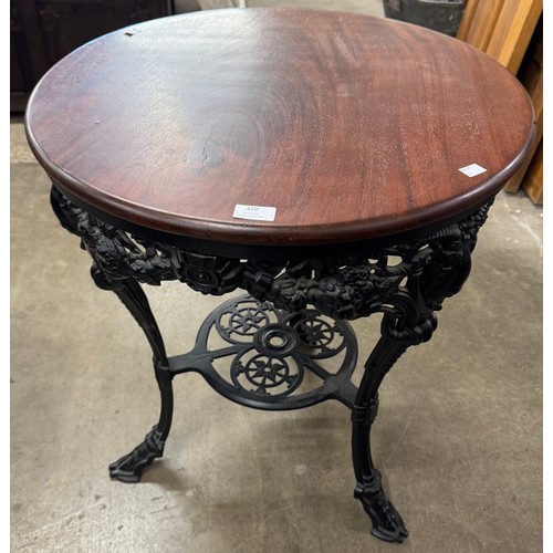 320 - A Victorian style mahogany and cast iron based pub table