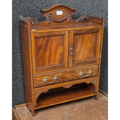 401 - A late Victorian mahogany two door wall hanging cupboard