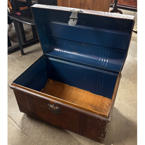 309A - An early 20th Century metal steamer trunk