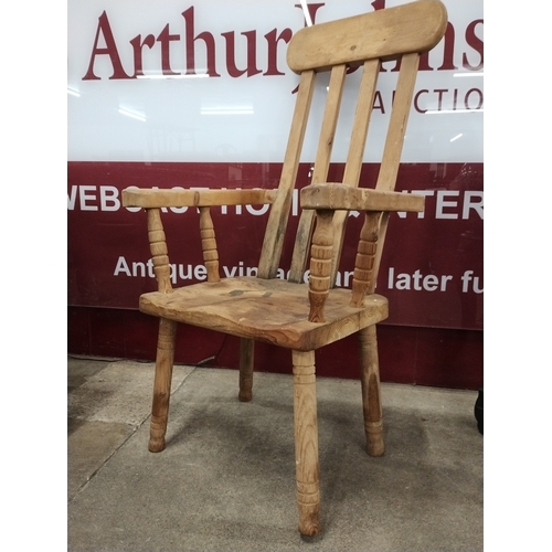 275A - A primitive pine farmhouse armchair