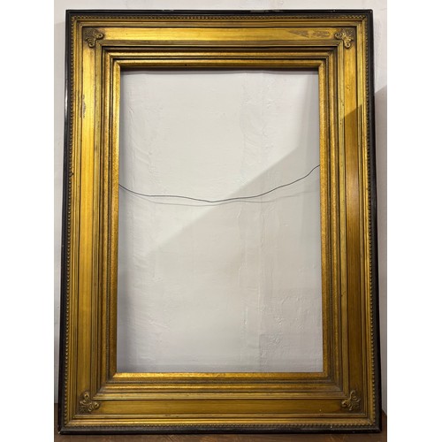 409 - A Victorian ebonised and parcel gilt picture frame