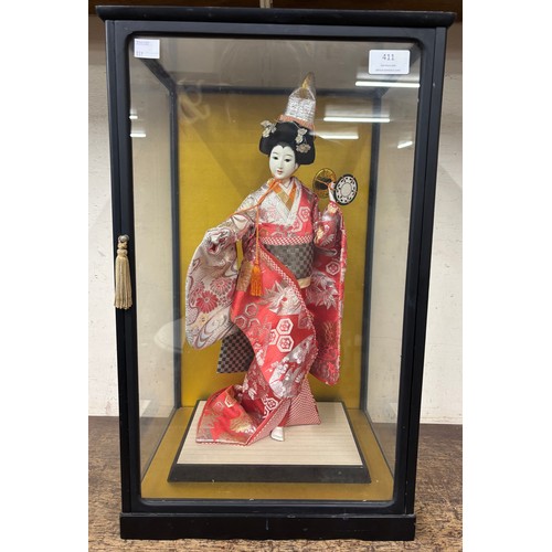 411 - A Japanese figure of a Geisha girl, cased