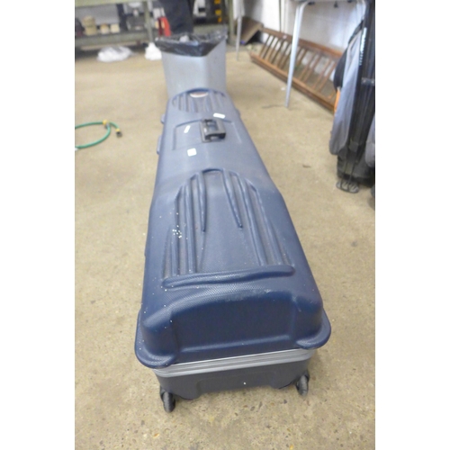A Datrek hard shell golf carry case