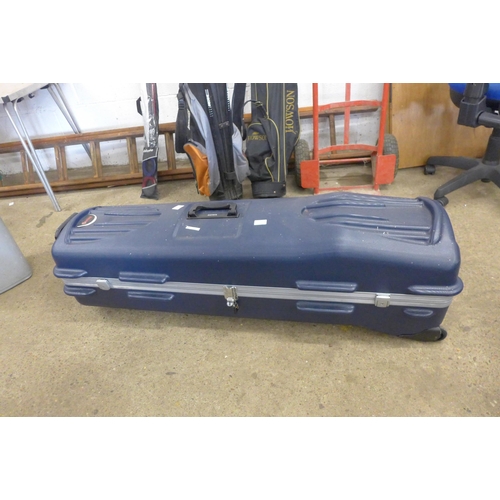 A Datrek hard shell golf carry case