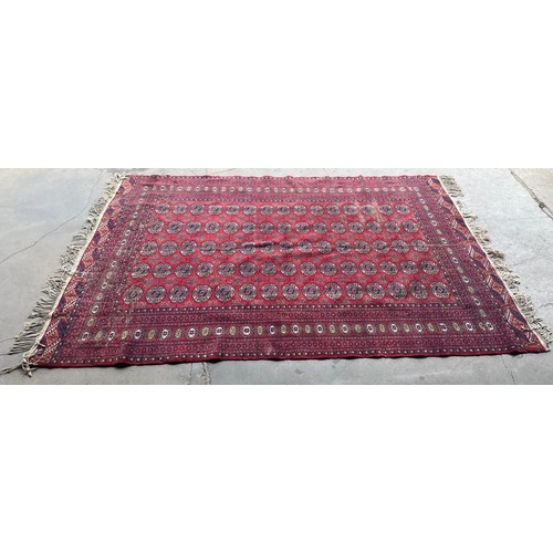 294A - A red ground rug, 260 x 180cm