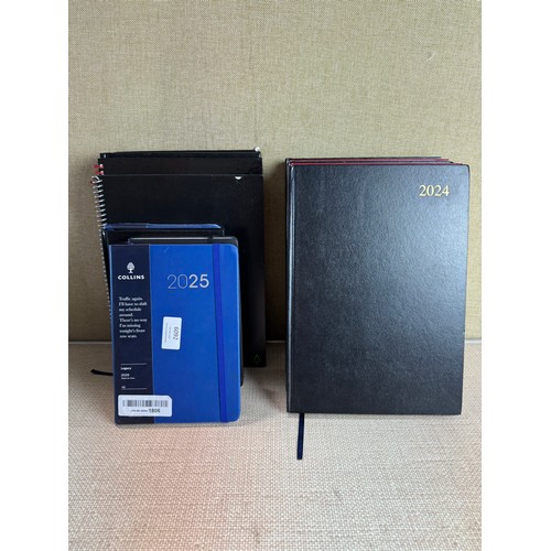 6031 - A quantity of miscellaneous office supplies to include 2024/2025 notebooks and planners, various cal... 