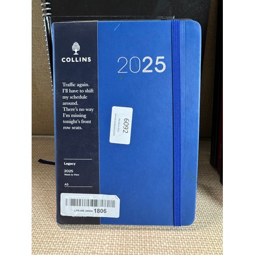 6031 - A quantity of miscellaneous office supplies to include 2024/2025 notebooks and planners, various cal... 