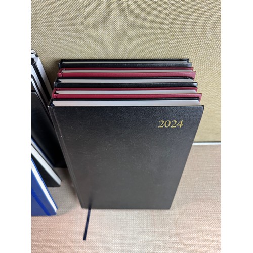 6031 - A quantity of miscellaneous office supplies to include 2024/2025 notebooks and planners, various cal... 