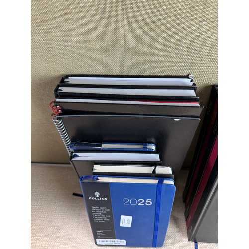 6031 - A quantity of miscellaneous office supplies to include 2024/2025 notebooks and planners, various cal... 