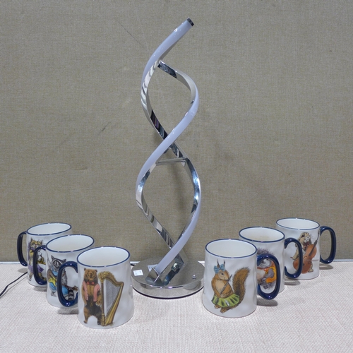 6270 - Artika chrome LED swirl table lamp and six Animal orchestra mugs (354-507,526) *This lot is subject ... 