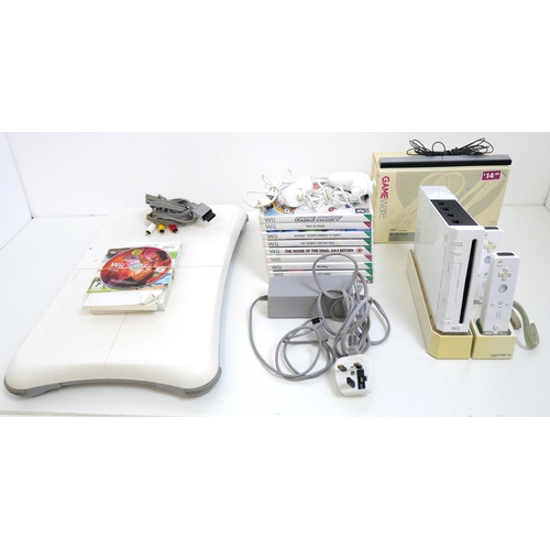 8002 - A Wii RVL-001 EUR Game Cube compatible console with stand, fill controllers all leads, balance board... 