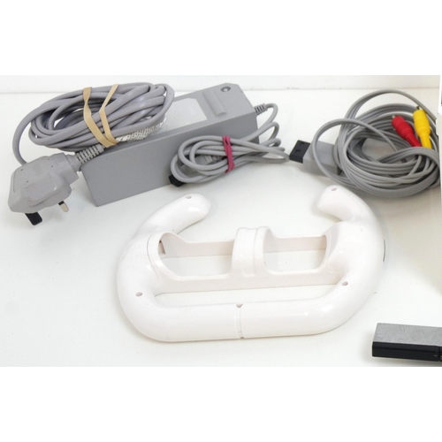 8003 - A Nintendo Wii games console with steering wheel controller adapter, power supply, sensor bar, AV ca... 