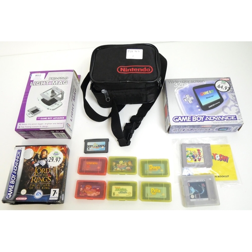 8012 - A boxed Gameboy Advance with manuals, a Gamester pro-fold light mag for GBA, boxed and a quantity of... 