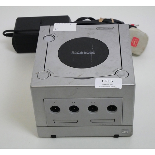 8015 - A silver Nintendo GameCube DOL-001 gaming console with power supply and AV cables