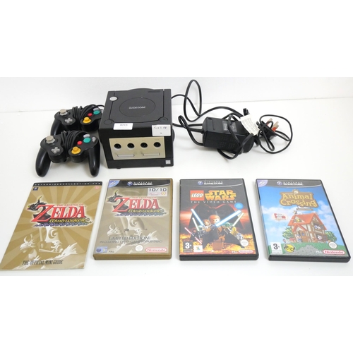 8016 - A black Nintendo GameCube with power cable, 2 controllers and 3 games including Lego Star Wars The V... 