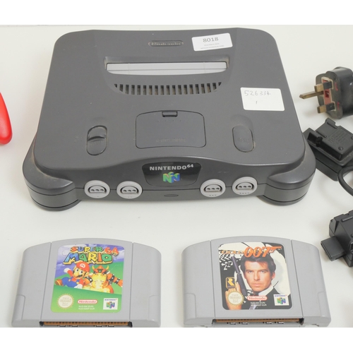 8018 - A Nintendo 64, 2 controllers, (1 original, 1 competition Pro) and 5 games, Mario Kart 64, Super Mari... 