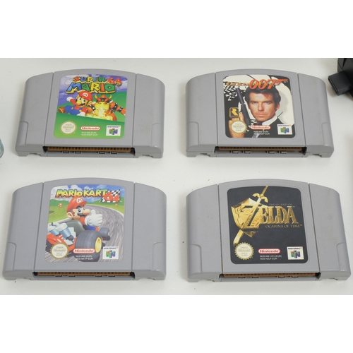 8018 - A Nintendo 64, 2 controllers, (1 original, 1 competition Pro) and 5 games, Mario Kart 64, Super Mari... 