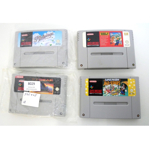 8029 - Four loose Super Nintendo games cartridges including Mario is Missing, Pilot Wings, Top Gear and Sup... 