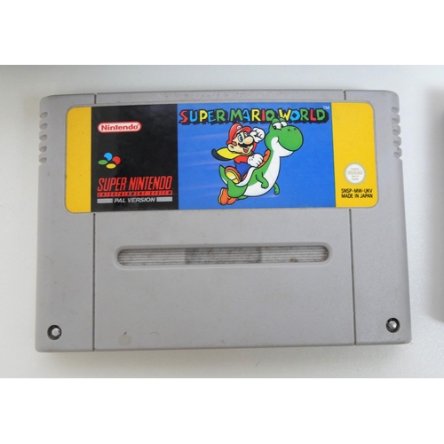 8031 - A Super Nintendo entertainment system with controller, power cable and 2 copies of Super Mario World... 