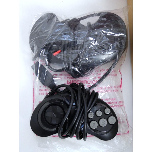 8044 - A boxed Sega Mega Drive II games console in 'Mega 6' packaging - comes with two control pads, power ... 