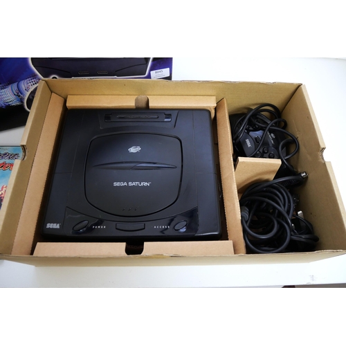 8045 - A boxed Sega Saturn games console complete with control pad, scart lead, power supply and a copy of ... 