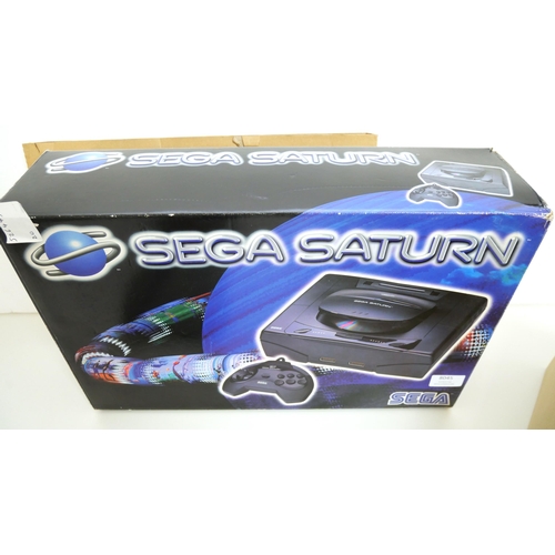 8045 - A boxed Sega Saturn games console complete with control pad, scart lead, power supply and a copy of ... 