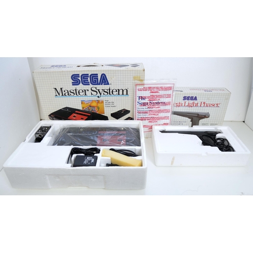 8047 - A boxed Sega Master system/power base console unused and complete with Sega light Phaser unused in b... 