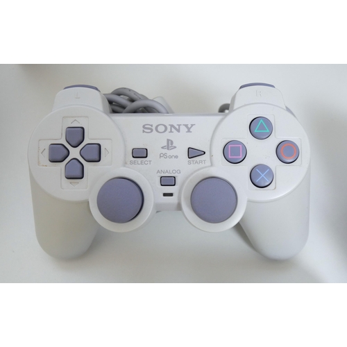 8056 - A boxed Sony Playstation (PS One) model SCPH-102B - complete with original packaging, console, analo... 