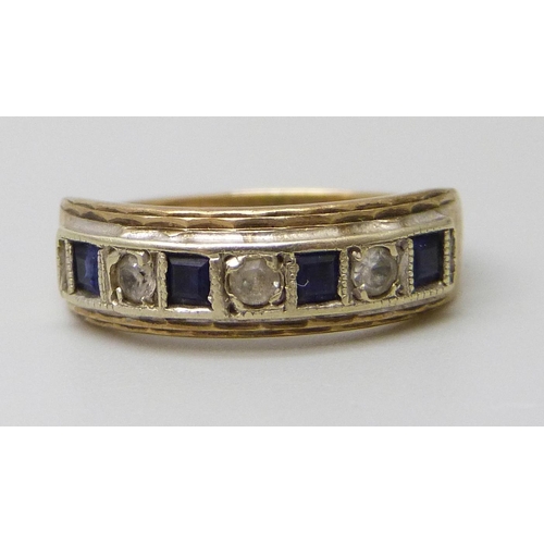 7029 - A 9ct gold, sapphire and white stone set ring, 2.4g, K