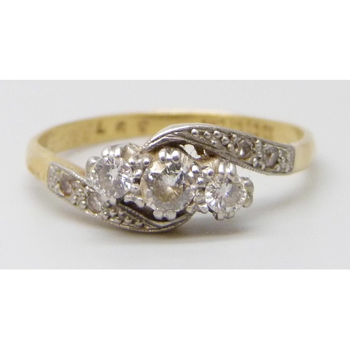 7031 - An 18ct gold and platinum set diamond ring, with inscription to inner shank, 2.7g, R