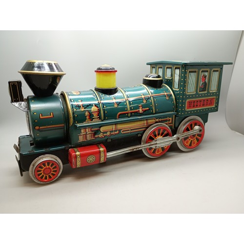 2006 - A battery operated green tin-plate Western model locomotive, Modern Toys, Japan, 33cm