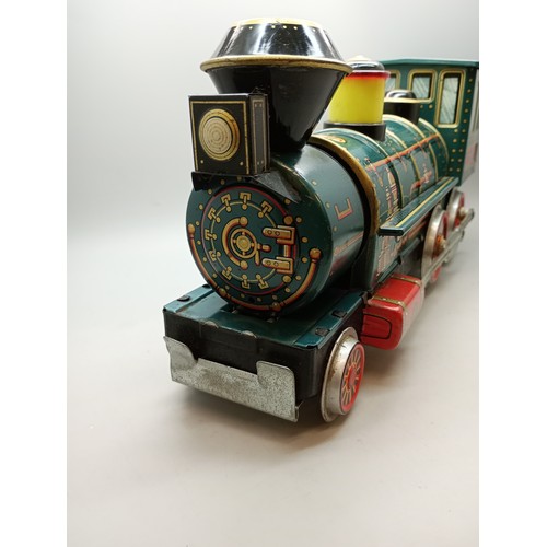 2006 - A battery operated green tin-plate Western model locomotive, Modern Toys, Japan, 33cm