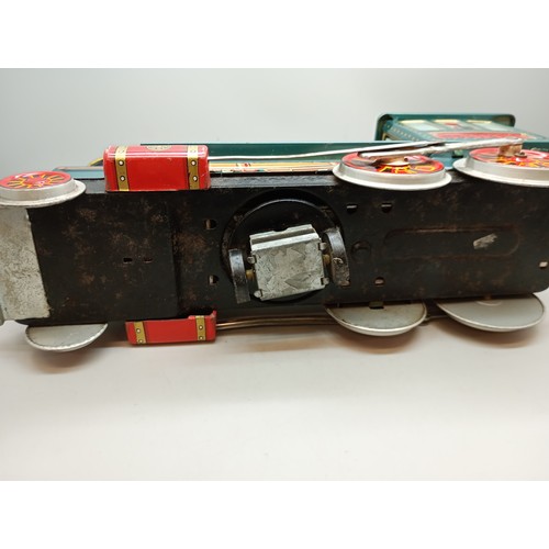 2006 - A battery operated green tin-plate Western model locomotive, Modern Toys, Japan, 33cm