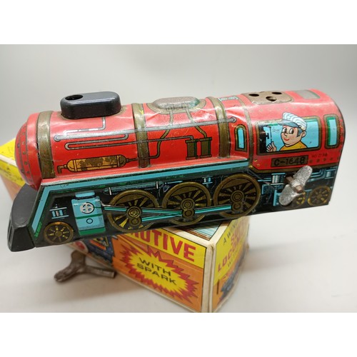 2020 - A tin-plate and plastic wind-up toy Super Locomotive with spark, Yone, made in Japan, in original bo... 