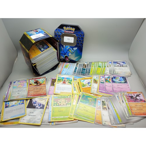 2022 - A large collection of Pokémon cards in collectors tin including holographic